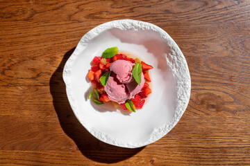 Strawberry ice cream with strawberries and fresh mint