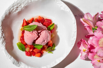 Strawberry ice cream with strawberries and fresh mint