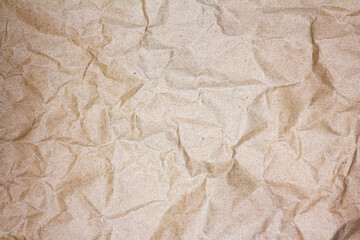 シワのある包装紙のテクスチャ、背景素材　茶色／ブラウン