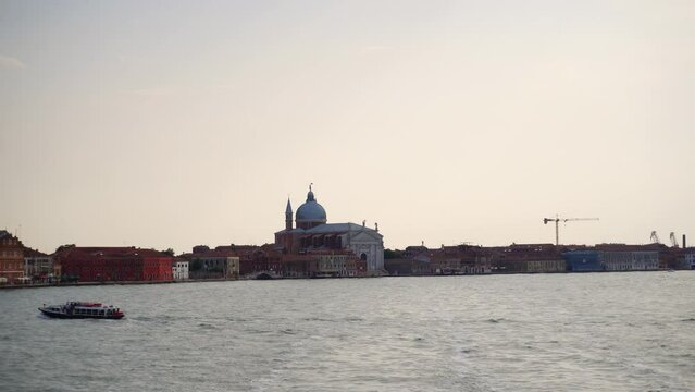 Venetian Lagoon With Church Of The Most Holy Redeemer In Background, Venice, Italy - wide