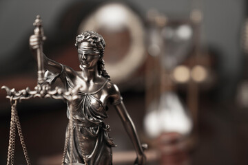 Fototapeta na wymiar Law and justice concept. Justice symbol - Themis sculpture on gray background.