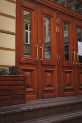 Wooden doors of house in Lviv city in autumn day