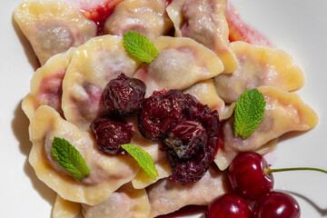 Dumplings with cherries and mint