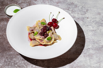 Dumplings with cherries and mint