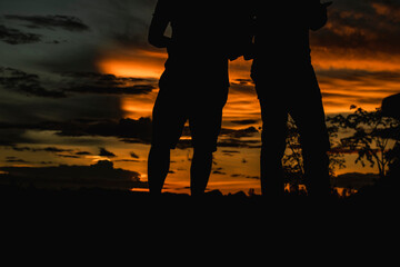 silhouette of tourists at sunset