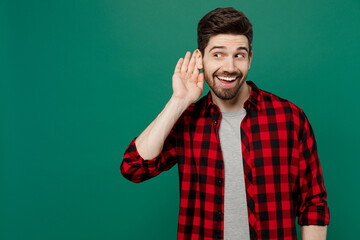 Young happy curious nosy caucasian man he 20s wear red shirt grey t-shirt try to hear you overhear...