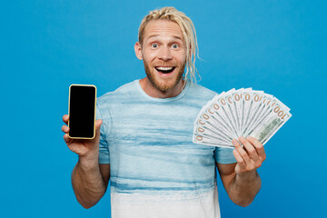 Young blond man with dreadlocks he wear white t-shirt hold fan of cash money in dollar banknotes...