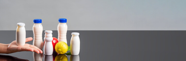 Panorama of probiotic bottles, yogurts with bifidobacteria additives. Dairy products to improve...