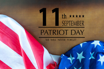 Fototapeta na wymiar Patriot Day September 11 9 USA banner - United States flag, 911 memorial and Never Forget lettering on blue background