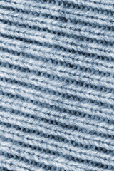 Macro knitted flat lay texture background. Close up pattern. Wool sweater macro detail.