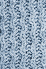 Macro knitted flat lay texture background. Close up pattern. Wool sweater macro detail.