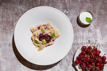 Dumplings with cherries and mint