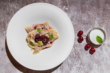 Dumplings with cherries and mint