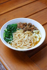 a bowl of chicken noodles
