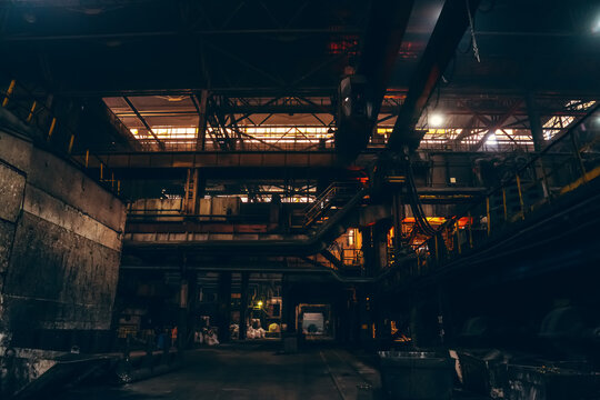 Large dark gloomy and creepy interior of steel plant.