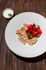 Dumplings with strawberries and mint