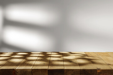 Desk with shadows and wall background. 