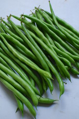 fresh green beans in white background