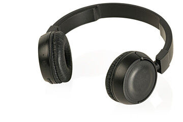 Black wireless headphones isolated on white background.