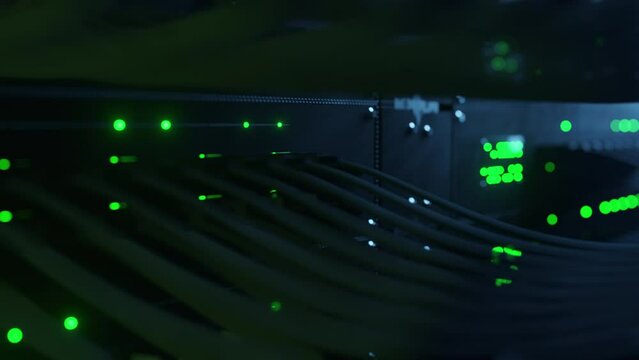 Super computer server racks in datacenter. Concept of big data storage and mining cryptocurrency. Network routers of ISP. Many wires connect to the network interfaces of powerful internet servers
