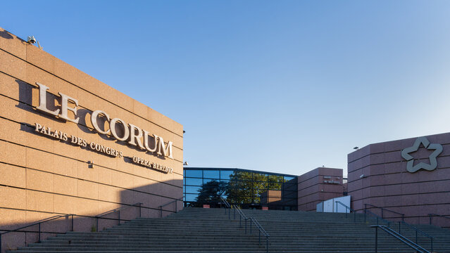 Montpellier, France - 07 12 2022 : Summer morning landscape view of the entrance to landmark Le Corum conference hall and opera house with name and logo