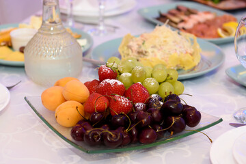 Fruits and berries dessert on the table. Healthy delicious vegetarian snack.