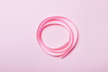Pink ribbon twisted into a circle festive