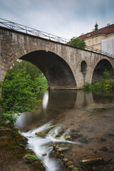Fototapeta na wymiar Weimar at river Ilm with bridge and park
