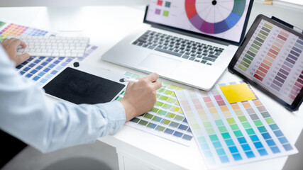 Professional development programmers are choosing color schemes to decorate their website or application to be attractive, Write information or code for the website,  HTML, Javascript, Color tone.