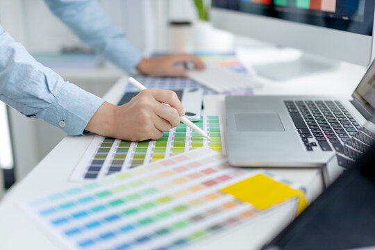 Professional development programmers are choosing color schemes to decorate their website or application to be attractive, Write information or code for the website,  HTML, Javascript, Color tone.