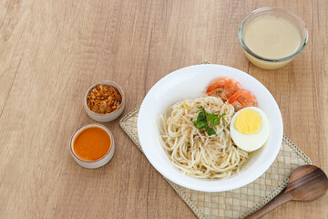 Mie Celor, a noodle dish from Palembang, South Sumatra, Indonesia. Served in a thick and savory shrimp broth with complements such as eggs, shrimp, bean sprouts, and celery.
