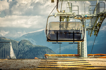 gondola ski lift in mountain ski resort, green forest