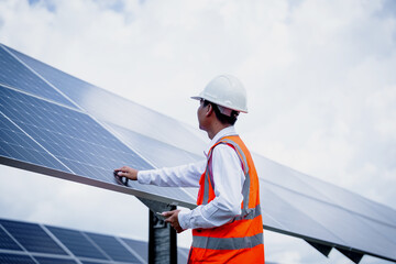 Businessman on a tour of solar power plants to check the operation of the power generation system. solar panels are an alternative electricity source to be sustainable resources in the future © Kampan