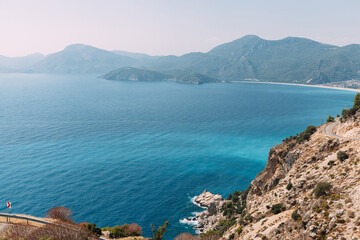 Obraz premium Travel destination. Aerial view of seascape in Oludeniz, Turkey. Sea and Mountains around turquoise water.