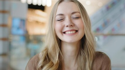 Close-up satisfied woman happy carefree successful cheerful smiling laughing girl blonde 30s woman enjoying victory winning success triumph dancing celebrating feeling satisfied moving to music dance