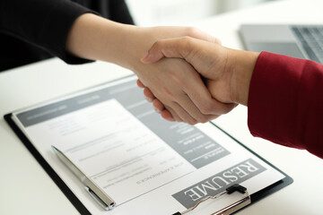 Employer shake hand with job applicants congratulates and welcomes new hires after successful negotiations for a job interview. Recruitment concepts