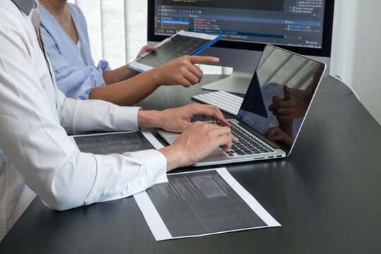 Team of programmers working with computer programming, professional development, and coding technology, working on high-quality visual software development websites