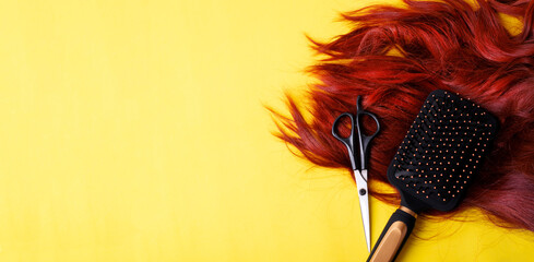 Web banner with hairdressing brush and scissors and red hair on yellow. Hairstyling tools....