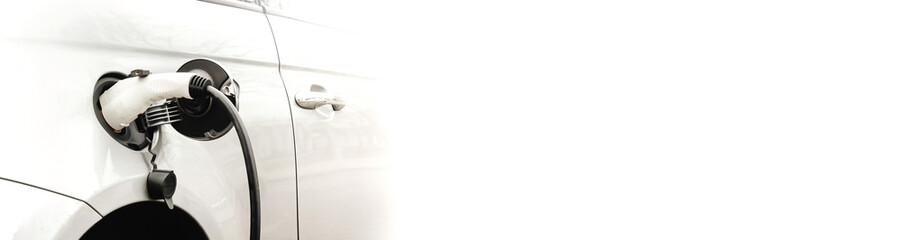 Electric car at the charging station background with free space in white color for the site....
