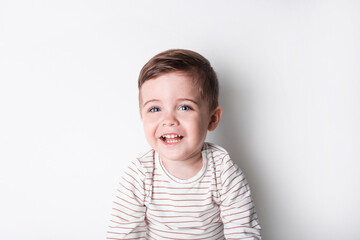 Beautiful invitation with happy toddler boy laugh. Healthy lifestyle. Kid life. Smiling happy child on white background 