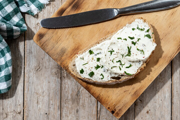 Cream cheese toast on cutting board. Top view. Copy space