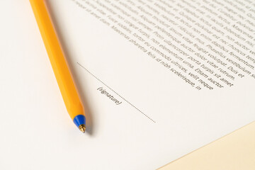 Close-up picture of sheet of paper wand pen ready to sign the documents. Paperwork, office concept.