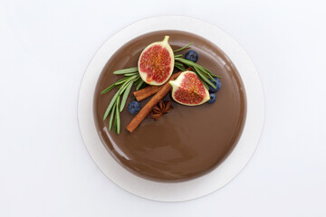 Chocolate mousse cake on white background top view