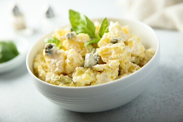 Traditional homemade potato salad with gherkins