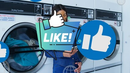 Animation of like text over african american woman using smartphone at public laundromat - Powered by Adobe