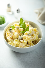 Traditional homemade potato salad with gherkins