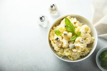 Traditional homemade potato salad with gherkins