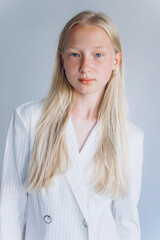 Fototapeta premium Young blondie caucasian girl on white background. Natural beauty, no make up, casual lifestyle girl. Young face