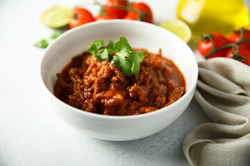 Homemade beef ragout with cilantro and lime