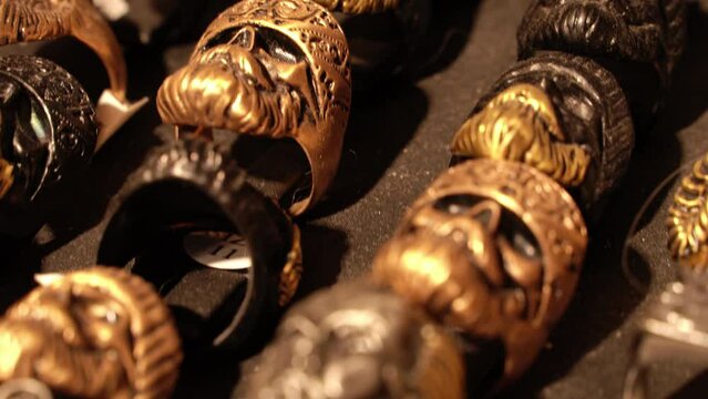 Close-up of terribly gold and silver skull rings.Skull rings that bikers or goths often wear.